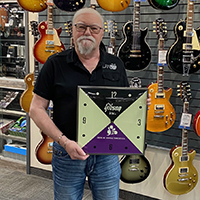 Contest winner Jacques L from Vaudreuil holding his new Gibson vintage lighted wall clock