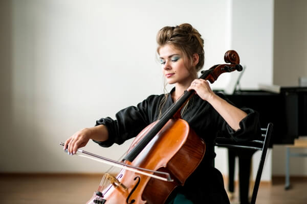 Female playing the Cello practicing for a performance