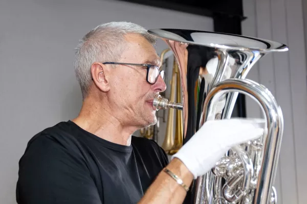 adult male playing the Euphonium in a band