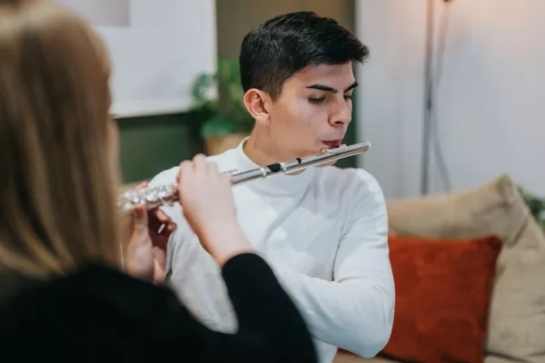 A teen taking a private Flute class with a teacher